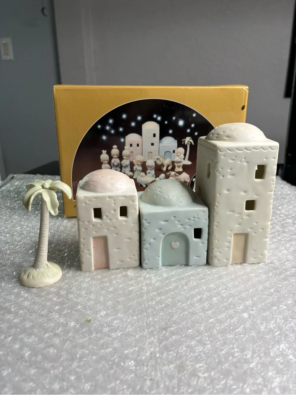 Precious Moments 4-piece set porcelain bisque nativity buildings and a palm tree
